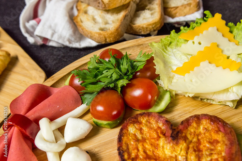 Close up of  traditional Turkish breakfast served with cheese, salami, tomato, cucumber and toasted bread