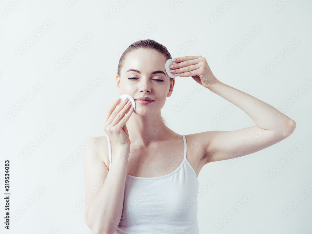 Woman makeup remove with cotton pad beauty healthy skin clean face Woman makeup remove with cotton pad beauty healthy skin clean face
