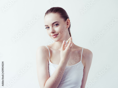 Perfume woman spray over white background