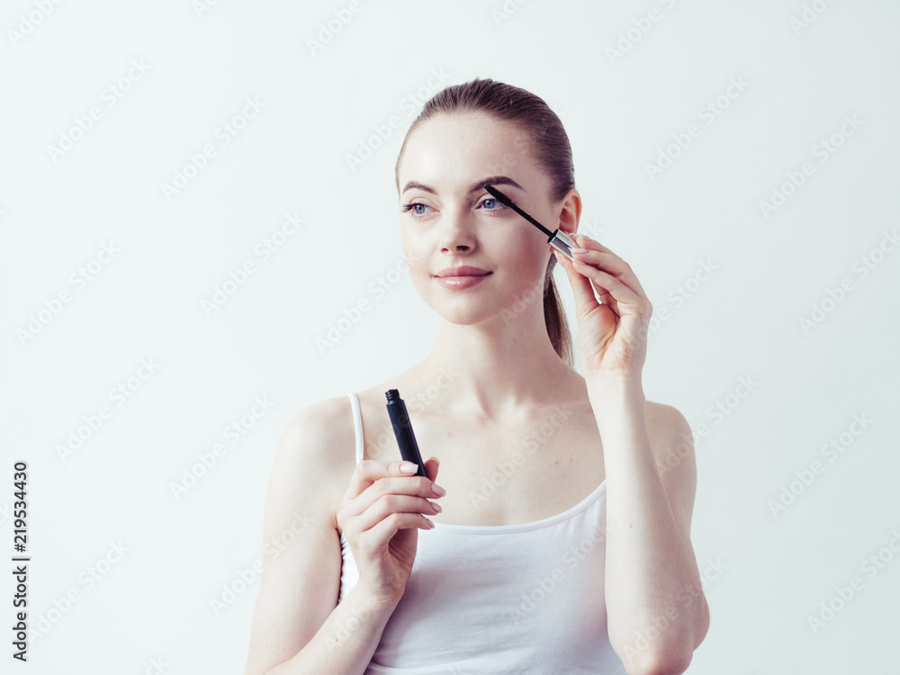 Woman applying mascara, beauty eyes lashes girl makeup Woman applying mascara, beauty eyes lashes girl makeup