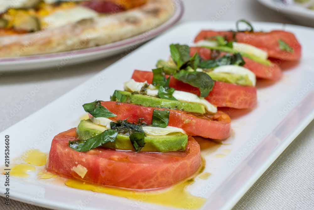 Delicious salad with white cheese and tomatoes Delicious salad with white cheese and tomatoes