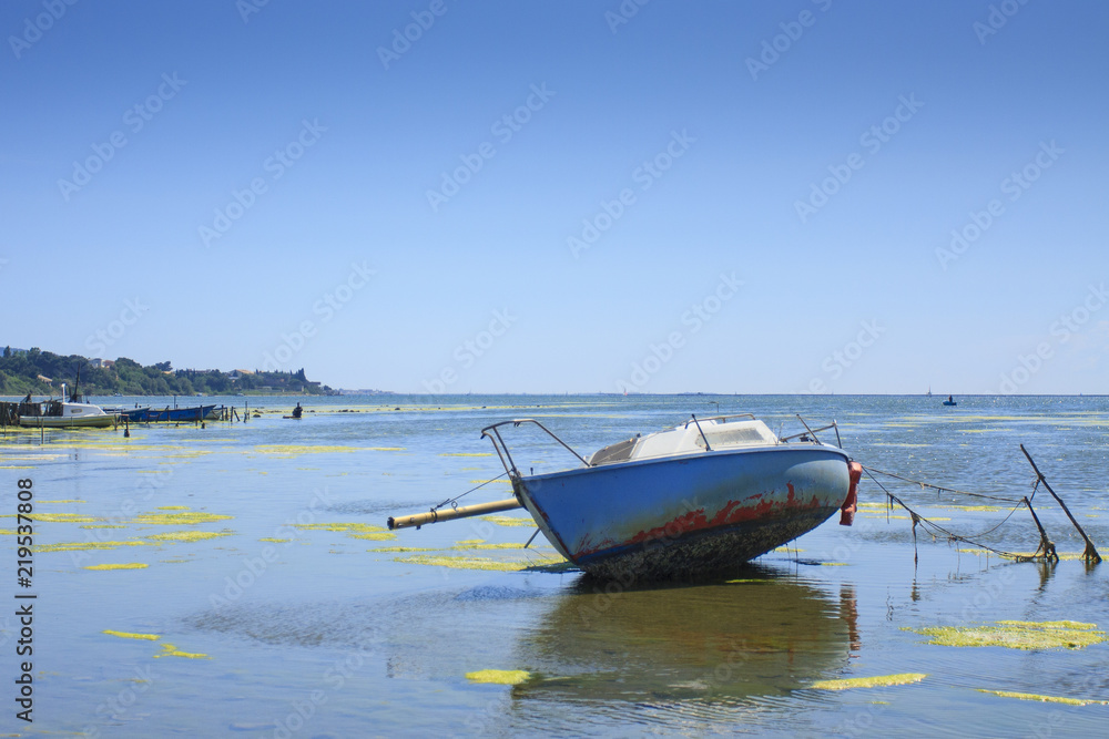 07/15/2017 Thau France. Boats lying at low tide on Thau pond in France