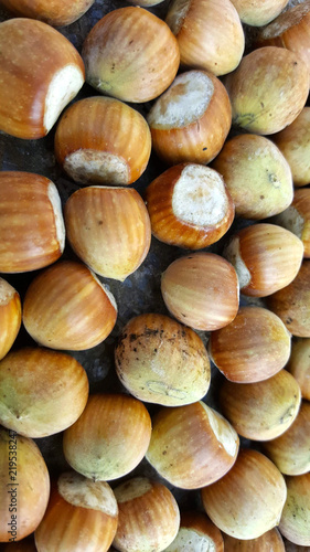 heap of organic hazelnut fruit, top view