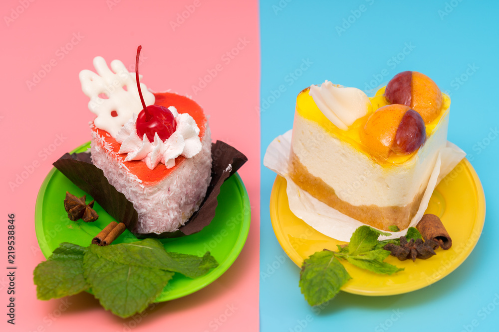 Green and yellow plates of food holding cake Green and yellow plates of food holding cake