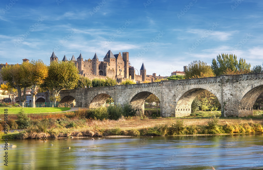 Carcassonne and the Le Pont Vieux bridge viewed from across the Aude river.  Southern France