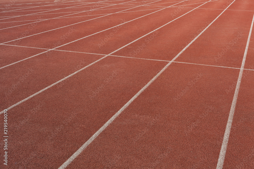 Numbers on the track is the finish pointred running track on athletic stadium background texture