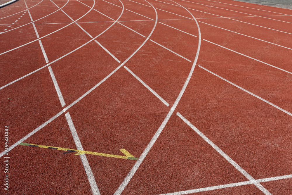 Numbers on the track is the finish pointred running track on athletic stadium background texture