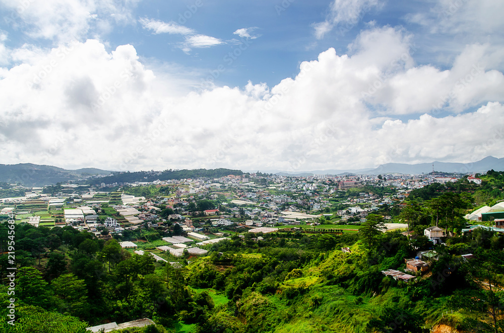 Fototapeta premium Dalat city, Vietnam, View of many houses from hill, The architecture of Dalat, Cityscape, Panorama landscape. a Lat (Dalat) is famous for its wide variety of flowers, vegetables and fruit.