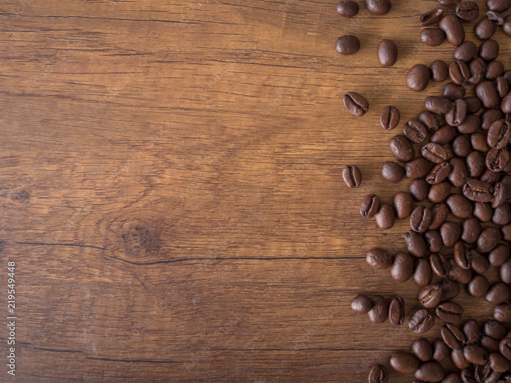 Coffee beans on wood background Coffee beans on wood background