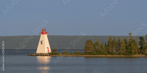 Kidston Island Lighthouse at twilight in Baddeck, Nova Scotia photo