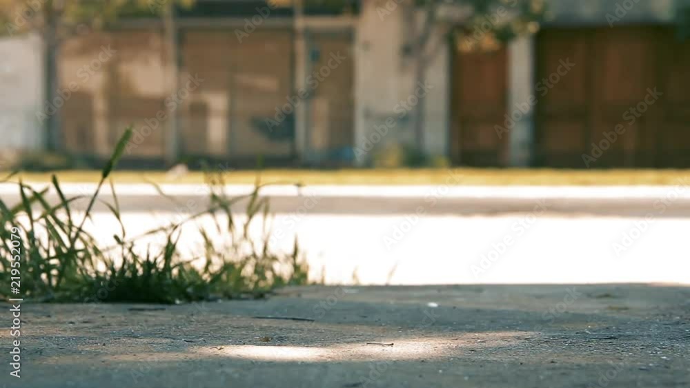 Boys Kicking the Ball On the Sidewalk. Boys Kicking the Ball On the Sidewalk.