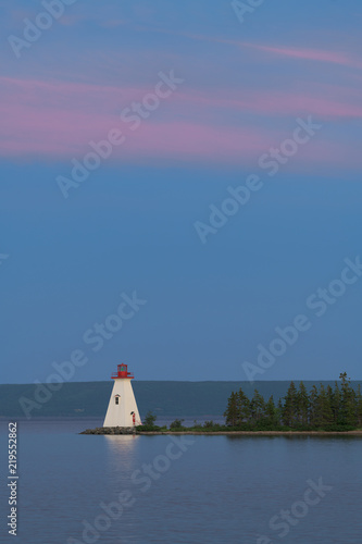 Kidston Island Lighthouse at twilight in Baddeck, Nova Scotia photo