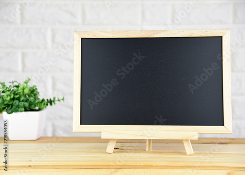 blank blackboard On the wood table In the classic room copy space for your text
