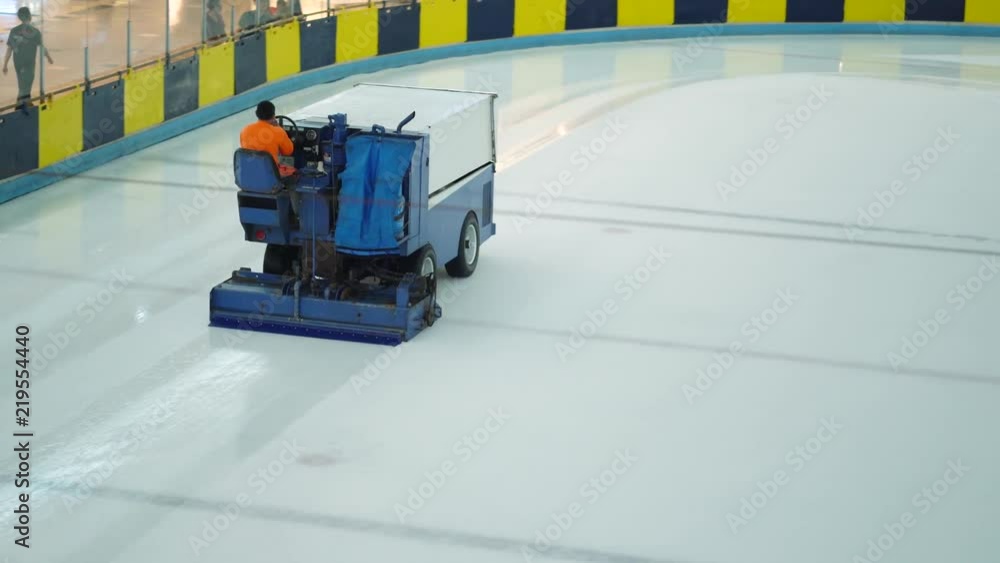 JAKARTA, Indonesia - August 23, 2018: Male worker cleaning ice hockey ...