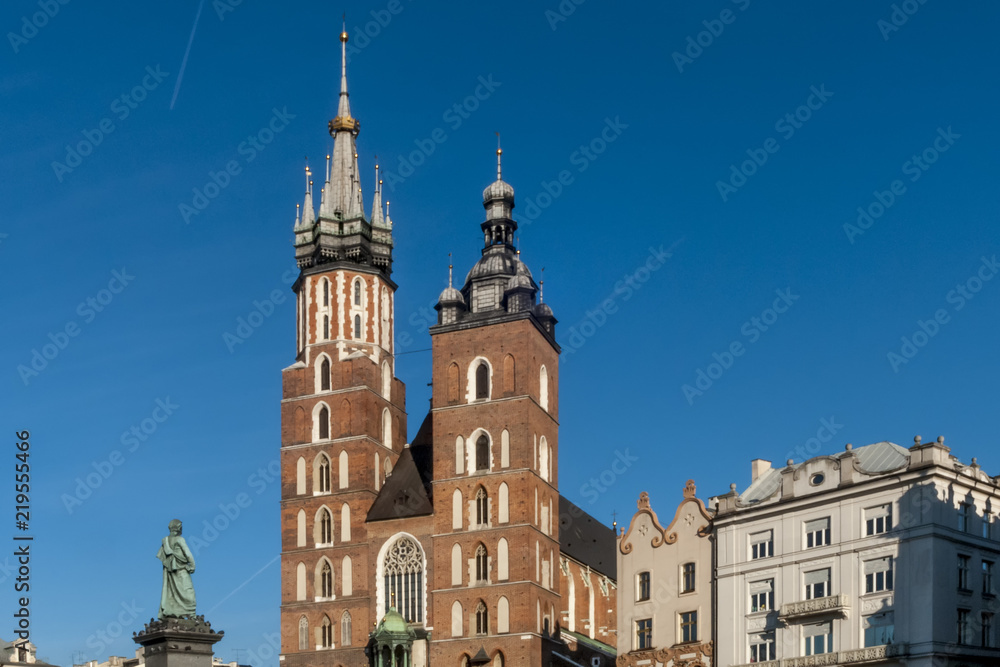 The two bell towers of the beautiful Saint Mary's Church in Krakow, Poland on a beautiful sunny day with blue sky