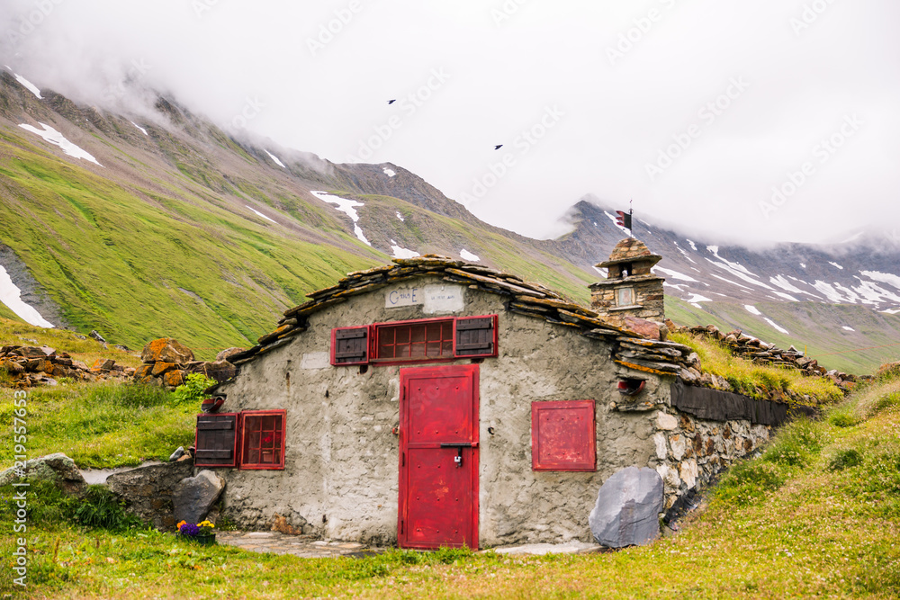 Mountain Stone Huts on Iconic Mont-Blanc Trail on a Cloudy Day Mountain Stone Huts on Iconic Mont-Blanc Trail on a Cloudy Day