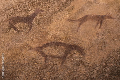 images of ancient animals on the wall of the cave. ancient art. history, archeology.
