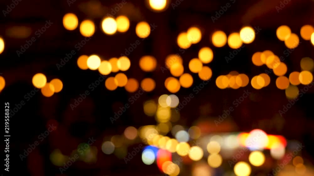 Multiple blurred defocused bokeh lights over a dark backgorund Multiple blurred defocused bokeh lights over a dark backgorund