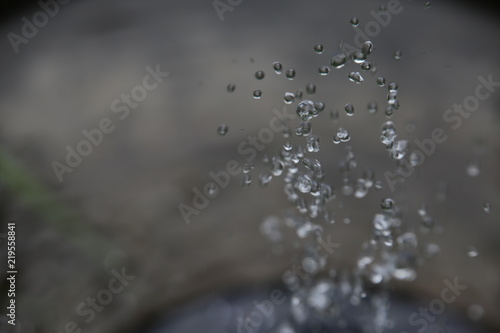 A closeup on the spray from a fountain