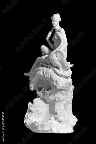 statue of a naked woman on a black background