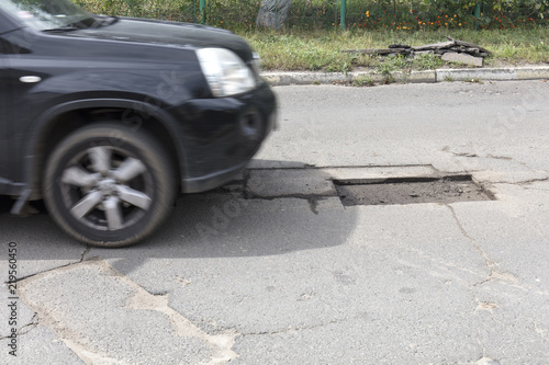  bad asphalt road, repair of asphalt road, pit on the road