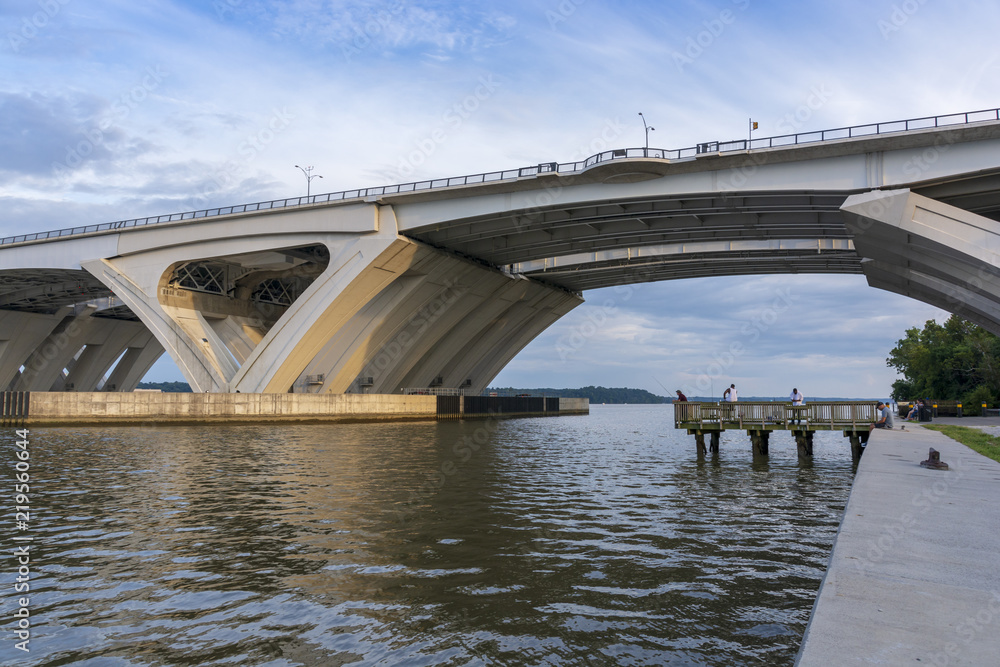 Below the Woodrow Wilson Memorial Bridge, which spans the Potomac River between Alexandria, Virginia, and the state of Maryland, as seen from Jones Point Park in Alexandria. Below the Woodrow Wilson Memorial Bridge, which spans the Potomac River between Alexandria, Virginia, and the state of Maryland, as seen from Jones Point Park in Alexandria.