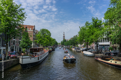 Amsterdam canals with boats © Catalina