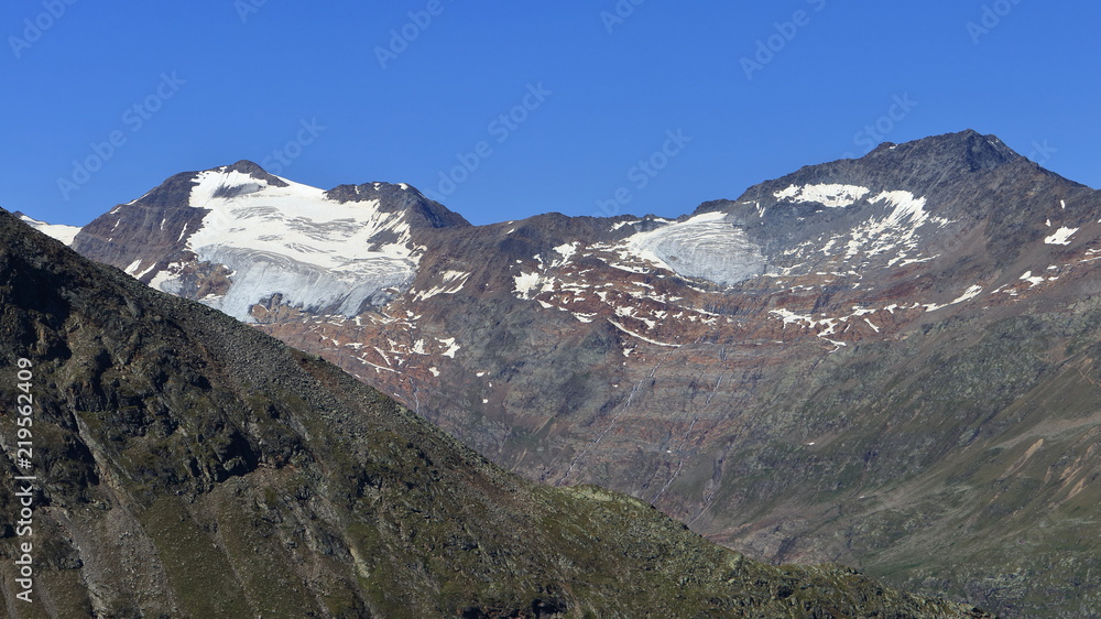 High mountains and sunlit alpine glaciers near Obergurgl, Oetztal in Tyrol, Austria.
