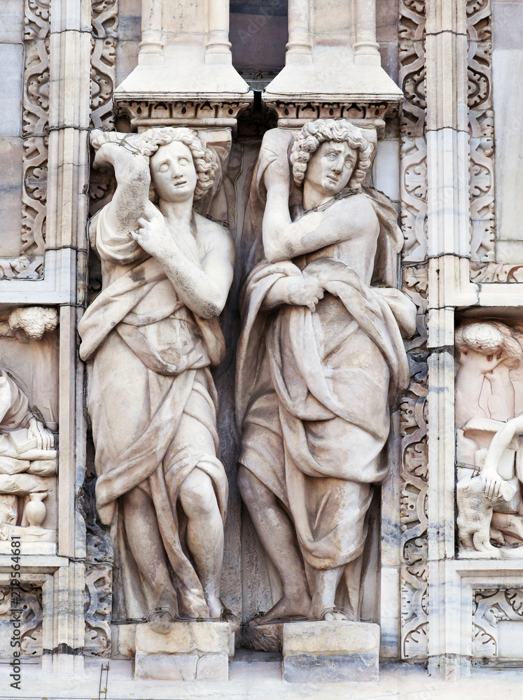 Statue on the wall of Milan cathedral