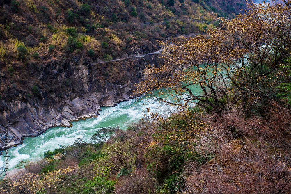 From the heights, overlook the majestic Jinsha River and the mountains on both sides, in Lijiang, Yunnan, China. From the heights, overlook the majestic Jinsha River and the mountains on both sides, in Lijiang, Yunnan, China.
