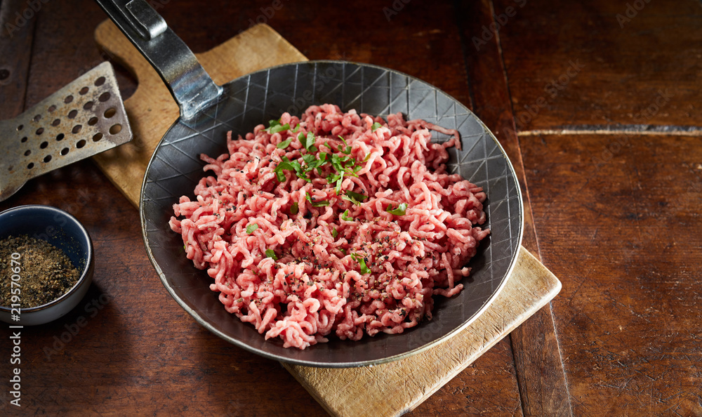 Pan with raw minced meat and chives Pan with raw minced meat and chives