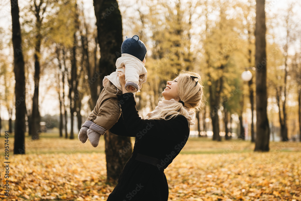 Portrait of a young mother with her baby in the autumn Park. Portrait of a young mother with her baby in the autumn Park.