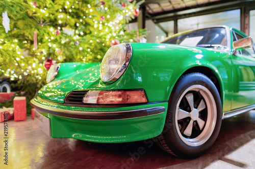 Headlight lamp of green vintage classic car Berlin