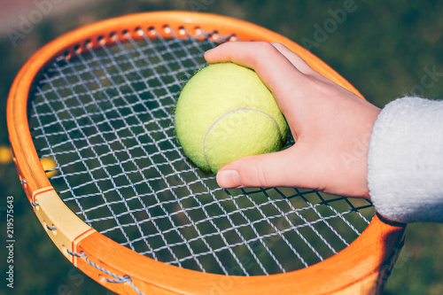 Hand of a boy with a tennis racket and a ball © andrey gonchar