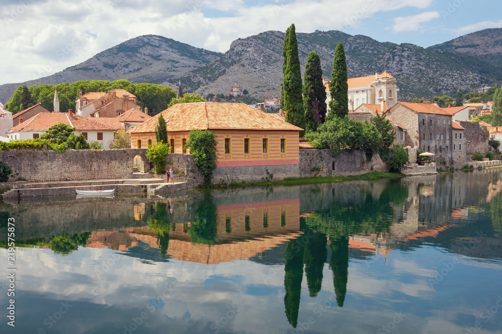 Beautiful ancient town on river bank. Bosnia and Herzegovina, view of Trebisnjica river and Old Town of Trebinje