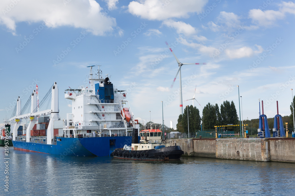 Cargo ship passing lock in Antwerp port