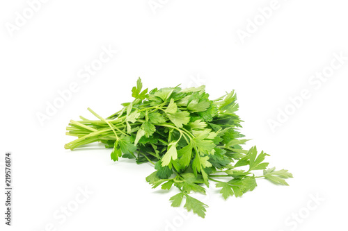 A bunch of flat leaf parsley against a white background