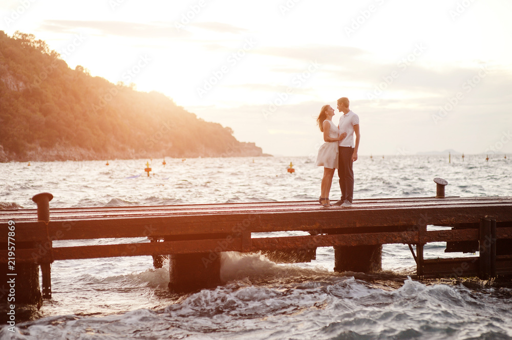Young couple in love at the port of Sorrento, Italy.