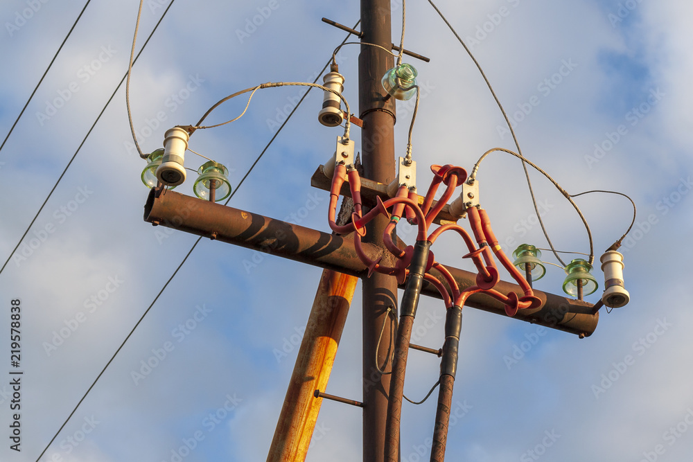 The upper part of the power transmission mast with bright wires. The upper part of the power transmission mast with bright wires.