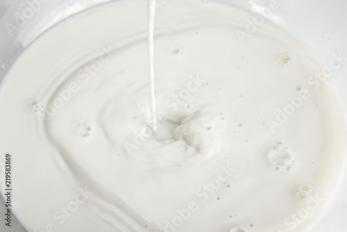 Pouring milk splash on the white background