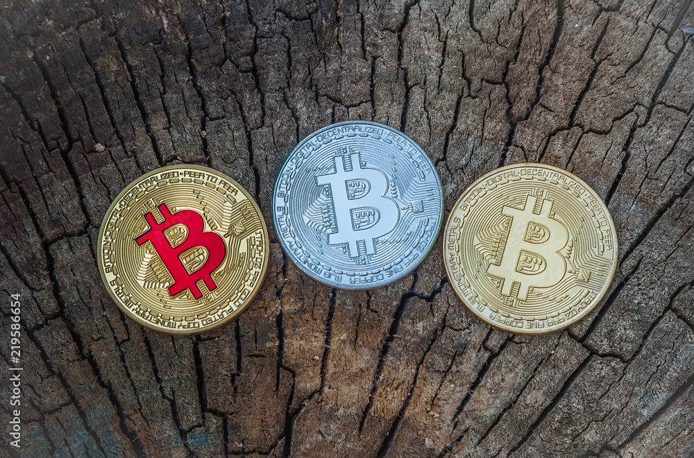 bitcoin monet. new currency in modern business world concept On a wooden texture. bitcoin monet. new currency in modern business world concept On a wooden texture.