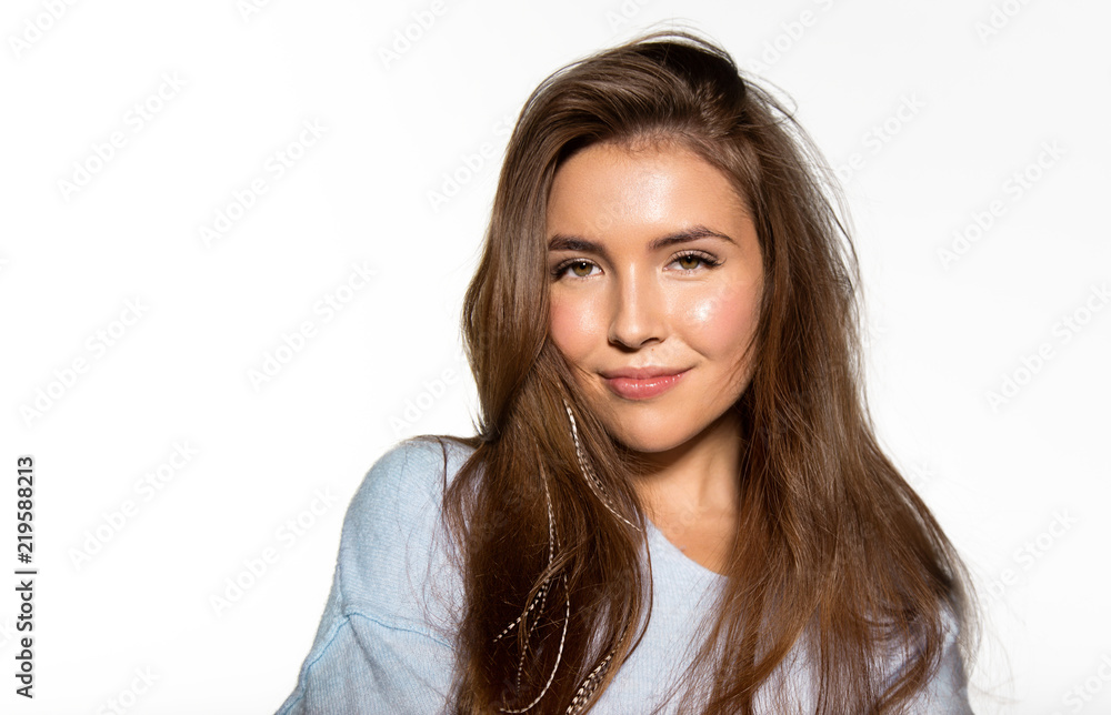 Portrait of cheerful sensual brunette in stylish sweater posing at studio. Cute laughing girl with nice dark brown eyes and perfect natural make-up looking at camera with gladness Portrait of cheerful sensual brunette in stylish sweater posing at studio. Cute laughing girl with nice dark brown eyes and perfect natural make-up looking at camera with gladness