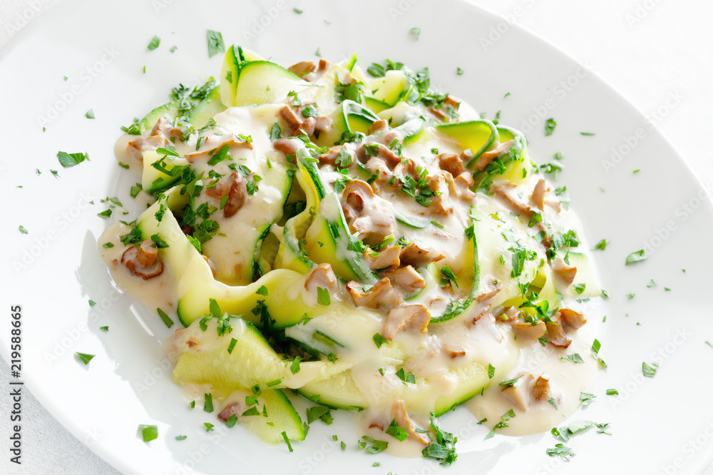 vegetable fettucine under white sauce with chanterellas sprinkled with parsley vegetable fettucine under white sauce with chanterellas sprinkled with parsley
