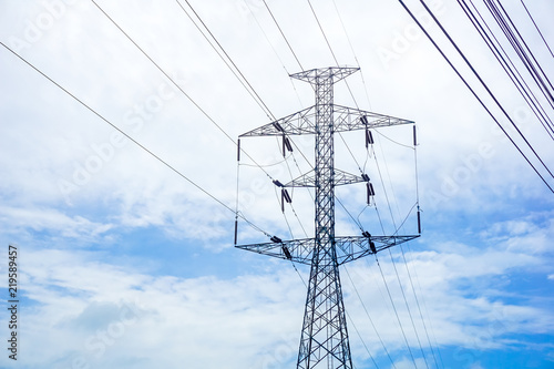 High voltage electricity pole with clear blue sky landscape