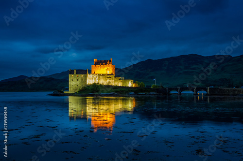 Illuminated Eilean Donan Castle at night  Scotland
