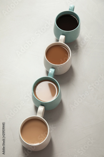 Cups of fresh aromatic coffee on gray background. Food photography © New Africa
