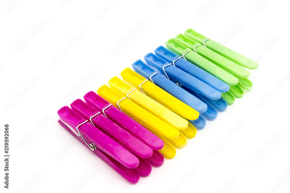Multi-colored clothespins isolated on white background. Multi-colored clothespins isolated on white background.