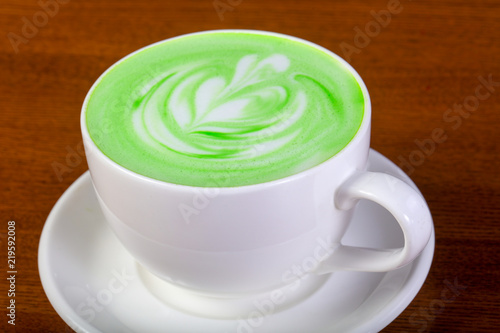 Green cappuccino with cream