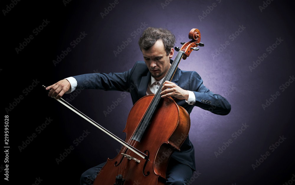 Fototapeta premium Lonely cellist composing on cello with nothing around 