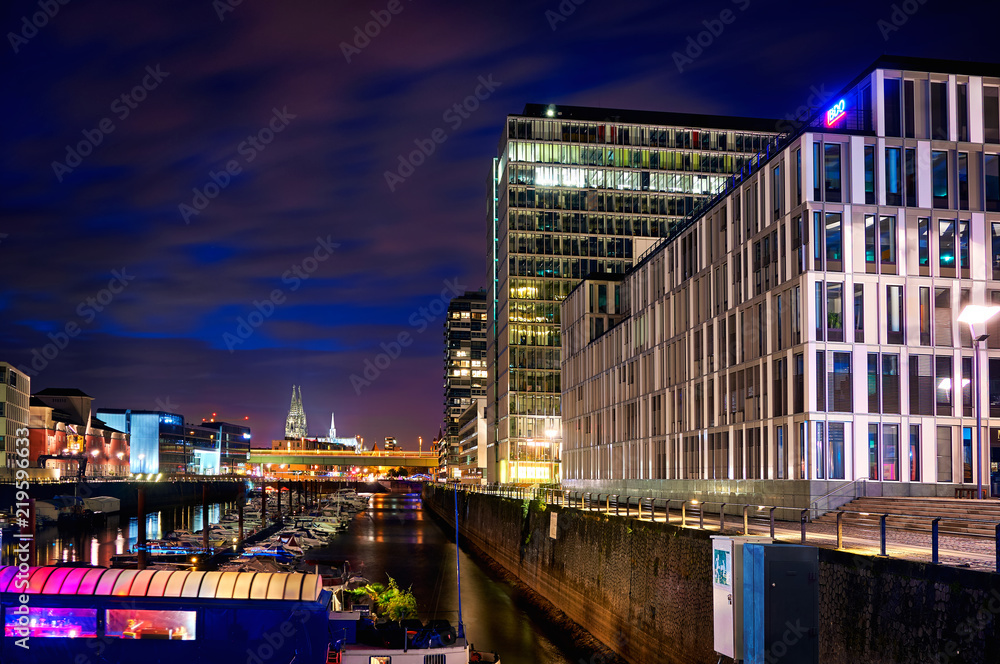 Rheinauhafen in Cologne Koeln marina at night and the Koelner Cologne Dom Cathedral Dom on the background Rheinauhafen in Cologne Koeln marina at night and the Koelner Cologne Dom Cathedral Dom on the background